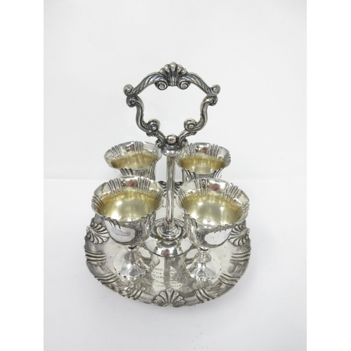 94 - A Victorian silver four Egg Cup Stand with central handle, engraved inscription, Sheffield 1899, 520... 