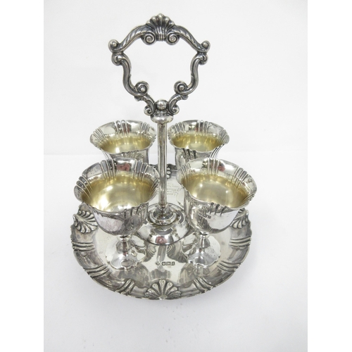 94 - A Victorian silver four Egg Cup Stand with central handle, engraved inscription, Sheffield 1899, 520... 