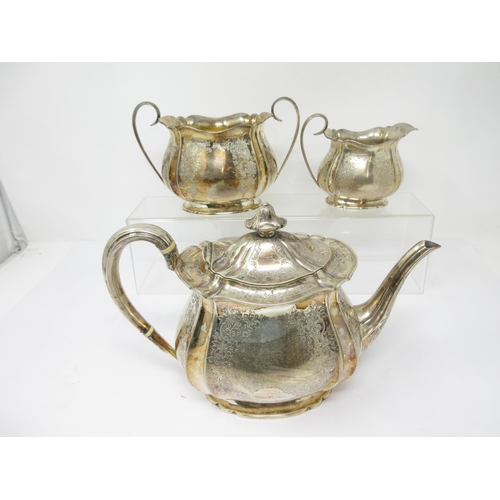 97 - A Victorian silver three piece Tea Service of bulbous form engraved flowers and leafage scrolls, She... 