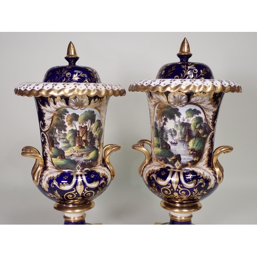 372 - A pair of Spode urn shaped two-handled Vases, decorated panels of landscapes with figures, sailing b... 