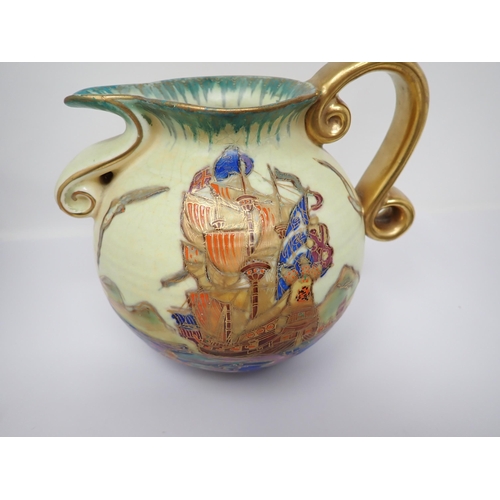 374 - A Crown Devon Jug with painted boat scene, gilt scroll handle, a small Moorcroft baluster Vase with ... 