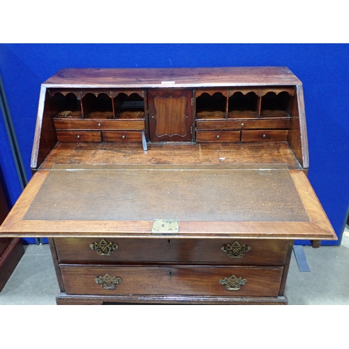 587 - A Georgian mahogany Bureau with fall flap enclosing series of pigeon holes and drawers around centra... 