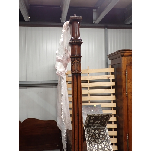 599 - A mahogany four poster Bed with reeded and carved front posts and a shaped headboard, 4ft 11in W x 6... 