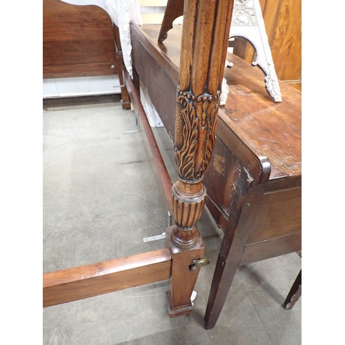 599 - A mahogany four poster Bed with reeded and carved front posts and a shaped headboard, 4ft 11in W x 6... 