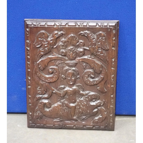 677 - A 17th Century oak Panel carved cherub on a dolphin surmounted by eagles and scrolls 17in x 14in