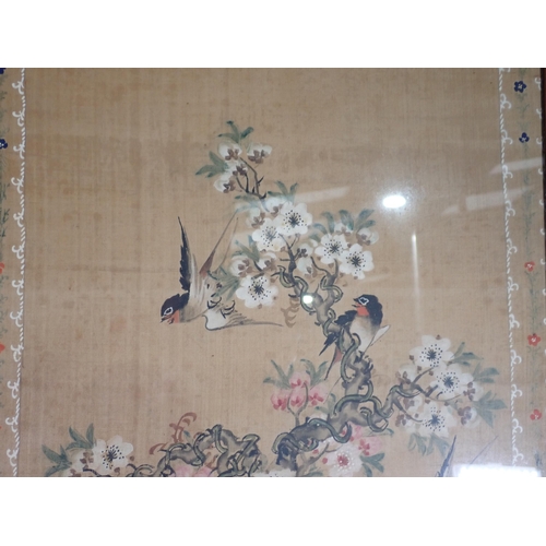 430 - A pair of Oriental silk Pictures decorated various birds on a floral branch with a decorative border