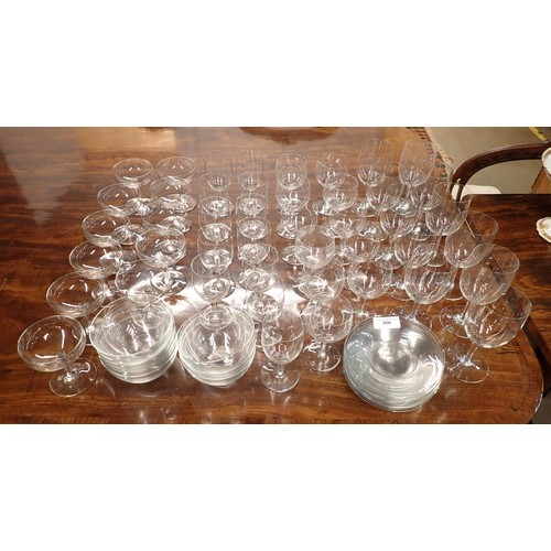 406 - A part suite of plain Baccarat Glasses with faceted stems viz; 11 champagne coupes, 11 claret, 11 bu... 