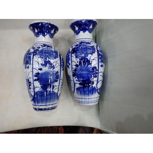 425 - A collection of 19th Century Chinese blue and white Vases, including a pair with panels of vases, 7½... 