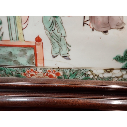 432 - A Chinese porcelain rectangular Panel or Block painted two seated Figures with attendants in famille... 