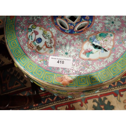 418 - A pair of 19th Century Chinese polychrome Garden Seats, the pierced tops decorated panels of birds a... 