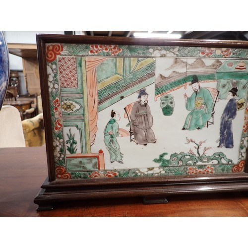 432 - A Chinese porcelain rectangular Panel or Block painted two seated Figures with attendants in famille... 