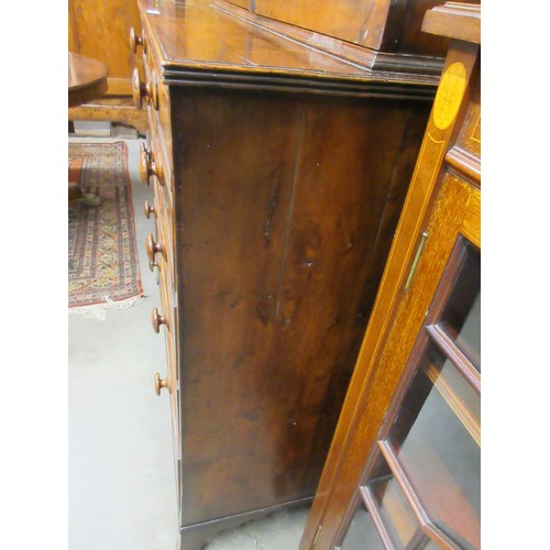 546 - An early 19th Century yew wood Secretaire Bookcase, the upper section with raised moulded panelled d... 