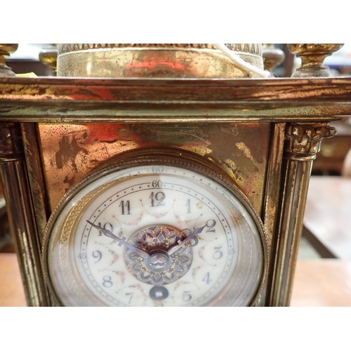 509 - A brass Mantel Timepiece, the domed top with enamel decoration, circular dial (A/F), above an enamel... 