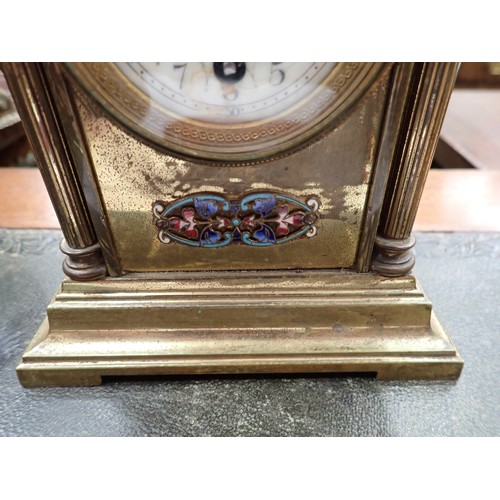 509 - A brass Mantel Timepiece, the domed top with enamel decoration, circular dial (A/F), above an enamel... 