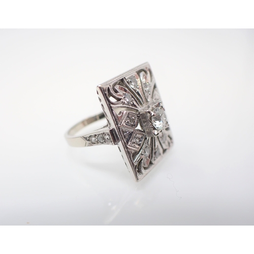 167 - An Art Deco style Cocktail Ring the rectangular openwork plaque millegrain-set principle old-cut sto... 