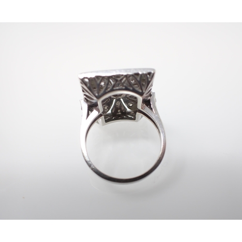 167 - An Art Deco style Cocktail Ring the rectangular openwork plaque millegrain-set principle old-cut sto... 