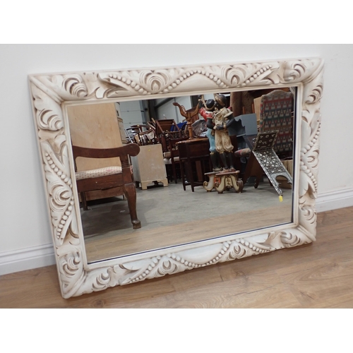 21 - A white framed Wall Mirror and a black painted framed Wall Mirror