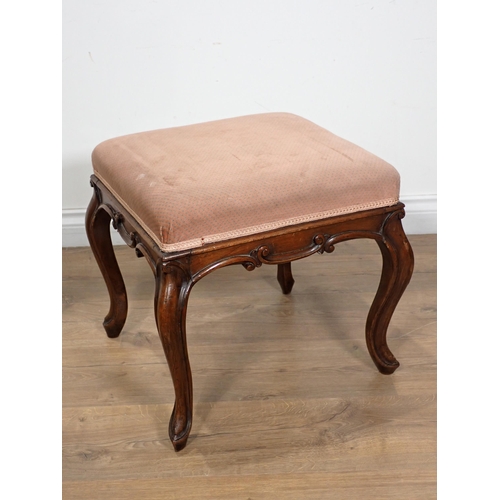 265 - A Victorian walnut Dressing Stool with upholstered top on cabriole supports with carved scroll edges... 