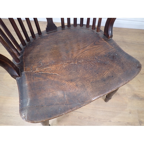 605 - An early 19th Century yew and elm Windsor Elbow Chair with pierced splat back, on turned supports an... 