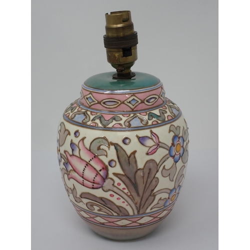 510 - A Charlotte Rhead Bursley Ware Wall Pocket and matching Table Lamp, decorated stylised flowers in co... 