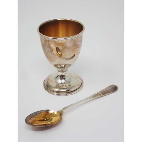 105 - A sterling silver Christening Mug with inscription, marked BIRKS, and a silver Egg Cup and Spoon, Bi... 