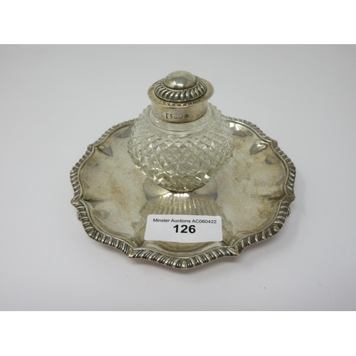 126 - An Edward VII silver circular Inkstand with gadroon rim, fitted cut glass inkwell on paw feet, Sheff... 