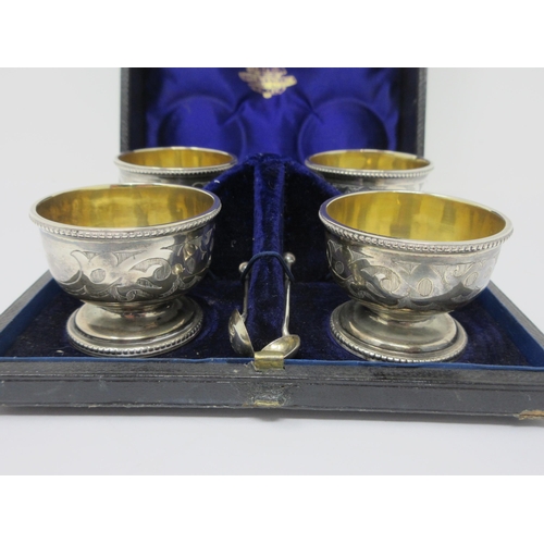 136 - Four Victorian silver circular Salts with scroll engraved friezes on pedestal bases, London 1867, wi... 