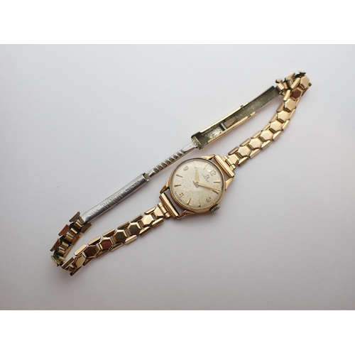 155 - ** WITHDRAWN ** A lady's Omega Wristwatch the cream dial with arabic numerals at quarters, the remai... 