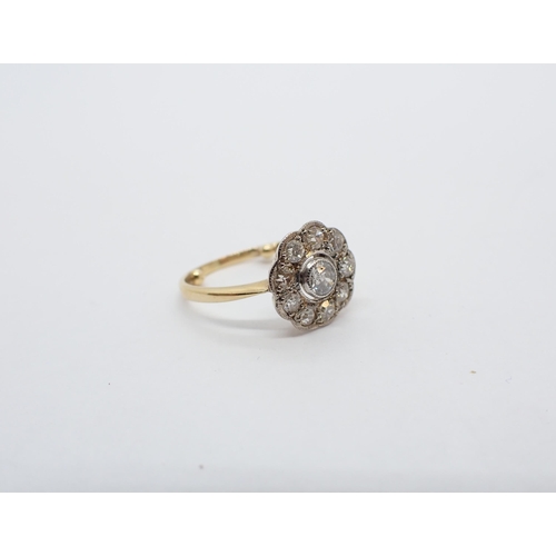 156 - ** WITHDRAWN ** A Diamond Daisy Cluster Ring millegrain-set old-cut stone within a frame of smaller ... 