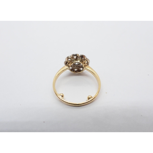 156 - ** WITHDRAWN ** A Diamond Daisy Cluster Ring millegrain-set old-cut stone within a frame of smaller ... 