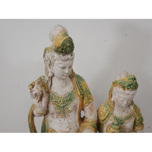 18 - A Figure, possibly terracotta, of two Oriental young females with partial glazed decoration 3ft 5in ... 