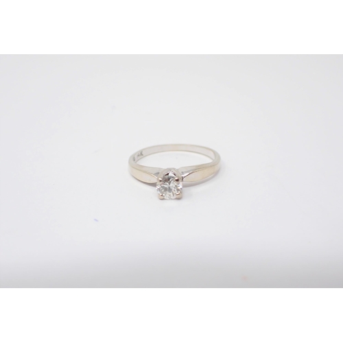 188 - A Diamond single stone ring claw-set brilliant-cut stone in white gold stamped 14K, ring size J