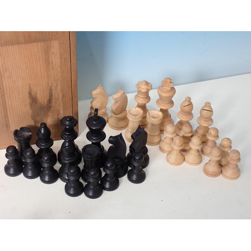 233 - Two boxed carved wooden Chess Sets and another Chess Set