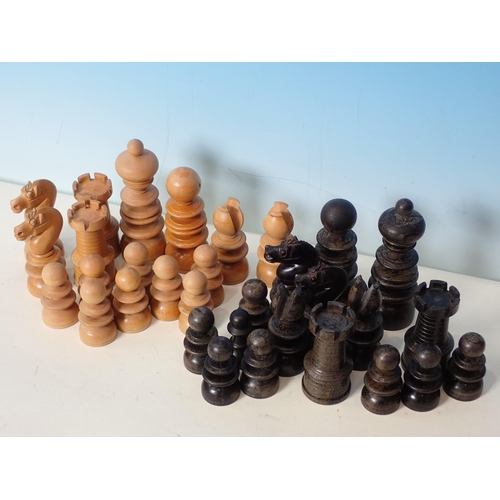 233 - Two boxed carved wooden Chess Sets and another Chess Set