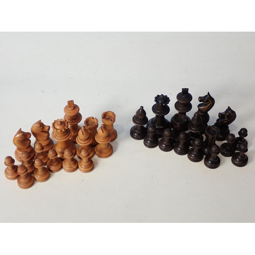 233 - Two boxed carved wooden Chess Sets and another Chess Set