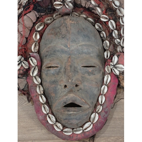 275 - A Dan, Ivory Coast ceremonial Mask with cowrie shell decoration