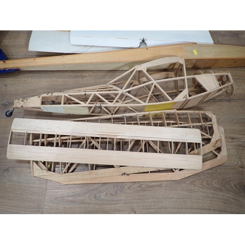 284 - A quantity of part built balsa wood radio controlled model Aircraft without fittings