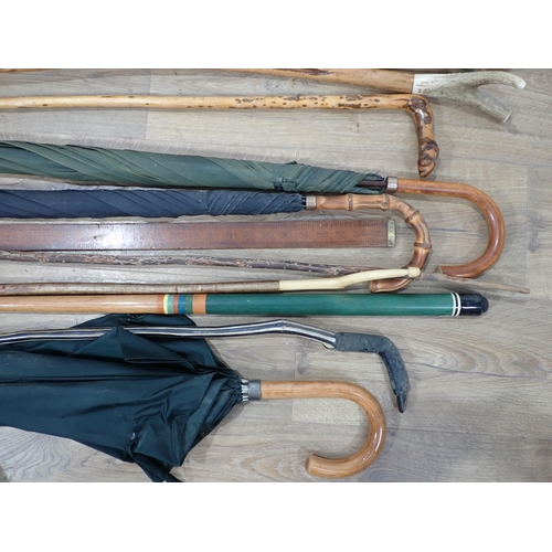 296 - A quantity of Walking Sticks, Shooting Stick and Umbrellas