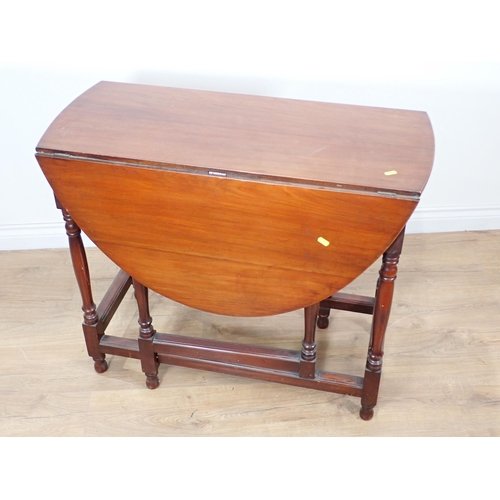 323 - A 19th Century mahogany gateleg Table with oval top on turned supports and moulded squared stretcher... 