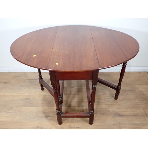 323 - A 19th Century mahogany gateleg Table with oval top on turned supports and moulded squared stretcher... 