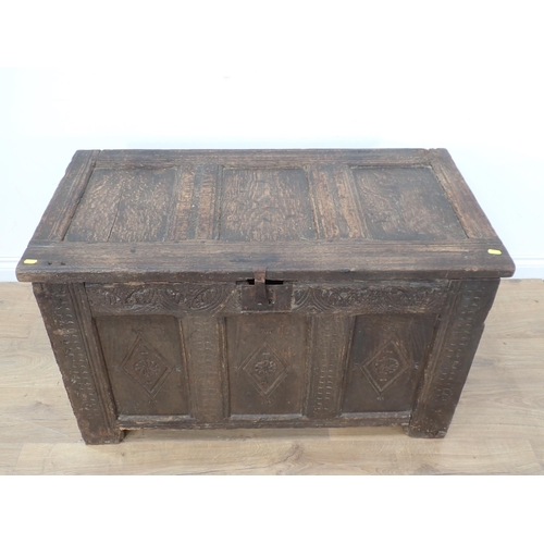 324 - A 17th Century oak Coffer with panelled top and lozenge carved three panelled front, 3ft 5in W