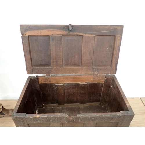 324 - A 17th Century oak Coffer with panelled top and lozenge carved three panelled front, 3ft 5in W