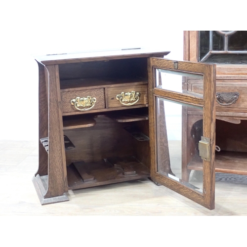 342 - An oak Table Cabinet with stained glass panelled door, drawer and shelves, 1ft 10in W x 1ft 9in H an... 