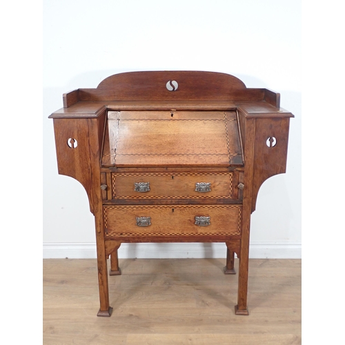 354 - An Arts and Crafts Desk with sloping front and two drawers with chequered inlay on squared supports,... 