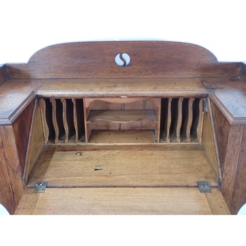 354 - An Arts and Crafts Desk with sloping front and two drawers with chequered inlay on squared supports,... 