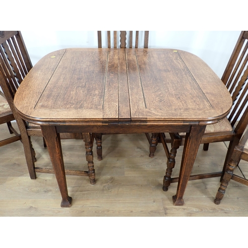 356 - An oak Drawleaf Dining Table and six Chairs and an oak veneered Bedroom pair