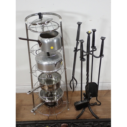 358 - A Kettle Stand and Kettles, two cast Fire Curbs and a wrought iron Companion set