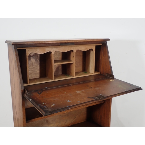 361 - A 1920's oak Desk with sloping front and fitted open shelves, 3ft 4in H x 2ft 2in W