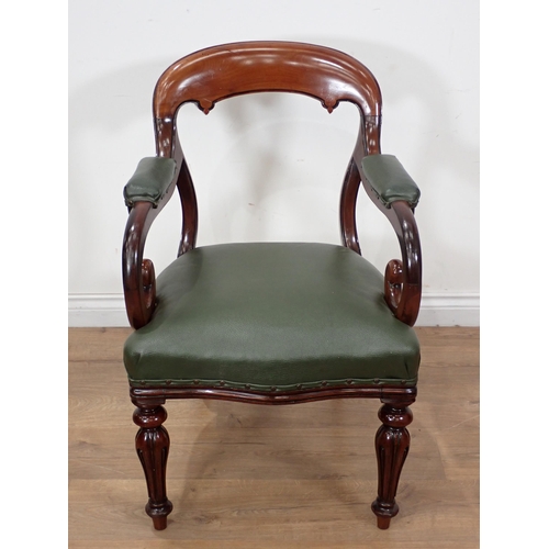 380 - A William IV mahogany Desk Chair with scrolled arms, upholstered seat on turned tapering front suppo... 