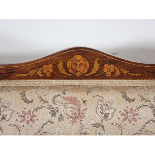 384 - An Edwardian rosewood and marquetry inlaid Settee with upholstered back and seat on turned front sup... 